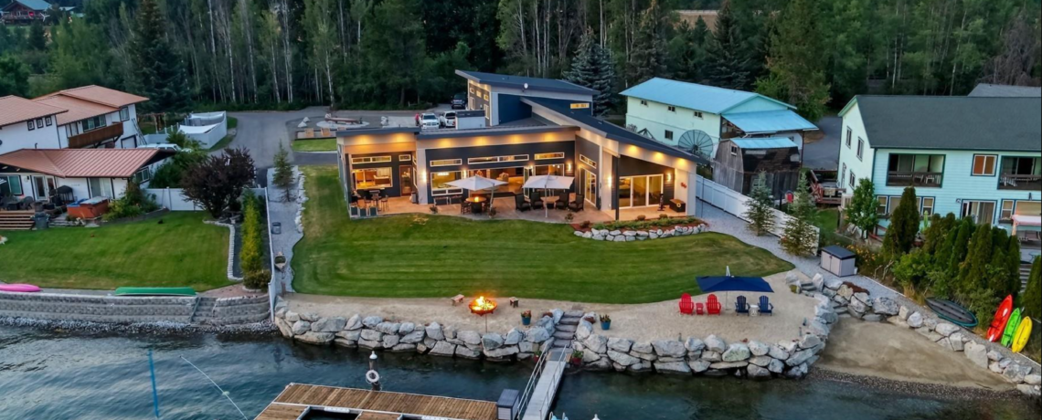Modern waterfront home with private beach, perfect for water sports, boats, swimming. Family and retiree retreat with gorgeous views.